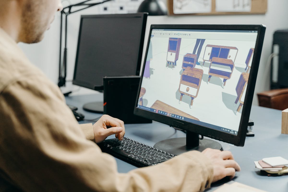 Product designer working on a 3D model on a computer — Amazon FBA product development starts with CAD